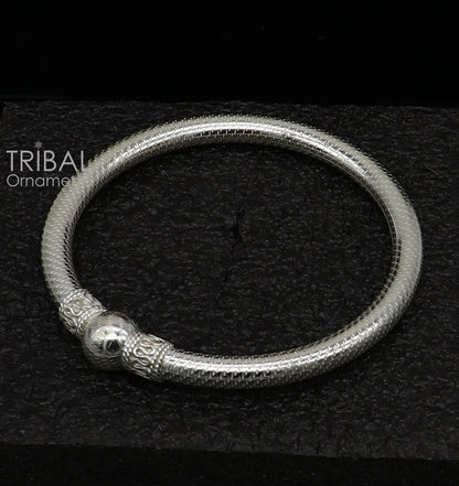 Sterling silver tribal bangle bracelet with a single shiny ball design, handmade ethnic jewelry by TRIBAL ORNAMENTS.