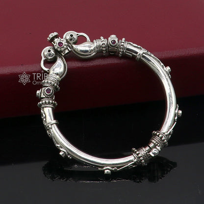 Sterling silver vintage peacock bangle bracelet with red stones, tribal ethnic design, handmade jewelry by Tribal Ornaments.