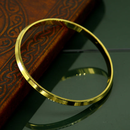 Gold polished silver bangle Sikhha Punjabi Kada by TRIBAL ORNAMENTS, unisex jewelry with a sleek, shiny finish, perfect for gifting.