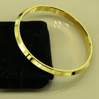 Handmade Punjabi Sikh solid silver gold-polished bangle bracelet by TRIBAL ORNAMENTS, showcasing a personalized tribal jewelry design.