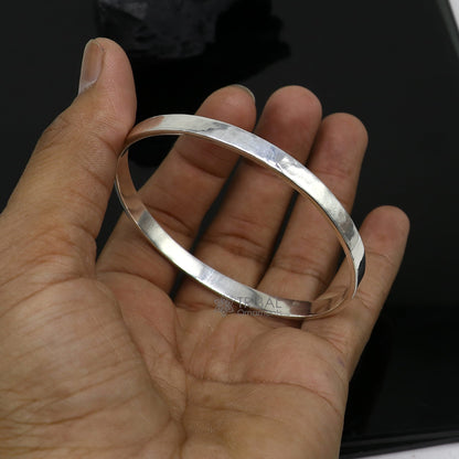 Shiny 925 silver bangle bracelet with flat plain design, modern trendy fashion accessory for men or girls by Tribal Ornaments.
