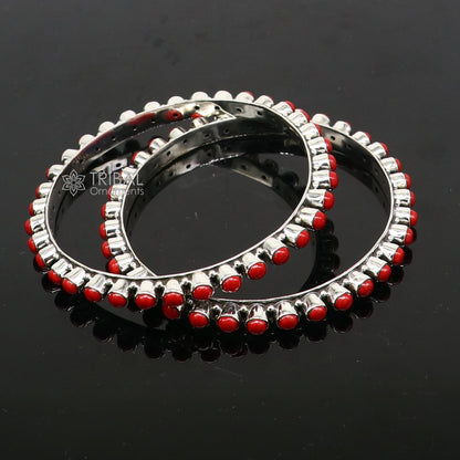 Sterling silver coral stone bangle bracelet with intricate tribal design, showcasing unique functional jewelry by TRIBAL ORNAMENTS.