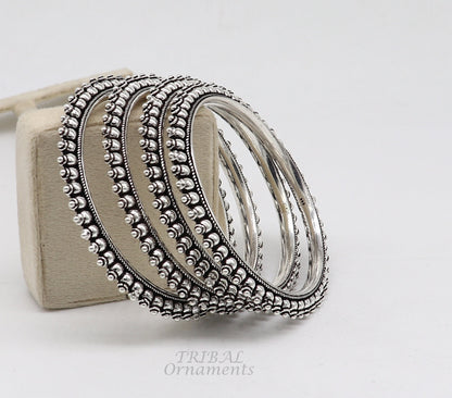 Sterling silver tribal bangle bracelet by TRIBAL ORNAMENTS, handmade cultural jewelry for women and brides, stylish and elegant.