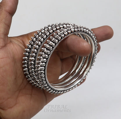 Sterling silver cultural bangle bracelet by TRIBAL ORNAMENTS featuring intricate tribal designs, ideal for brides and gift-giving.