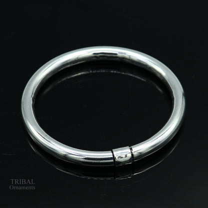 Sterling silver bangle bracelet by Tribal Ornaments, shiny and smooth, stylish kada suitable for men or girls, perfect for personalized gifting.