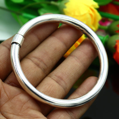 Sterling silver bangle bracelet by Tribal Ornaments, shiny and sleek, suitable for men or women, ideal for personalized gifting.