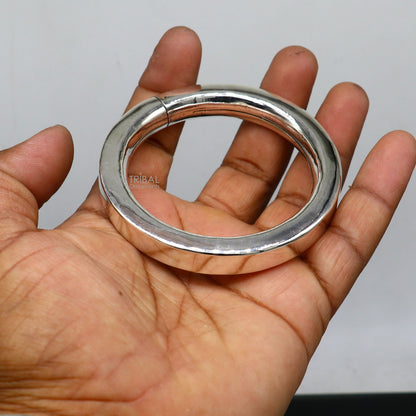 Sterling silver bangle bracelet by TRIBAL ORNAMENTS featuring a plain, shiny, bright finish, suitable for men or girls.
