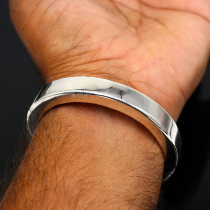 Sterling silver bangle bracelet by Tribal Ornaments, shiny and plain design, suitable for men or girls, stylish jewelry accessory.