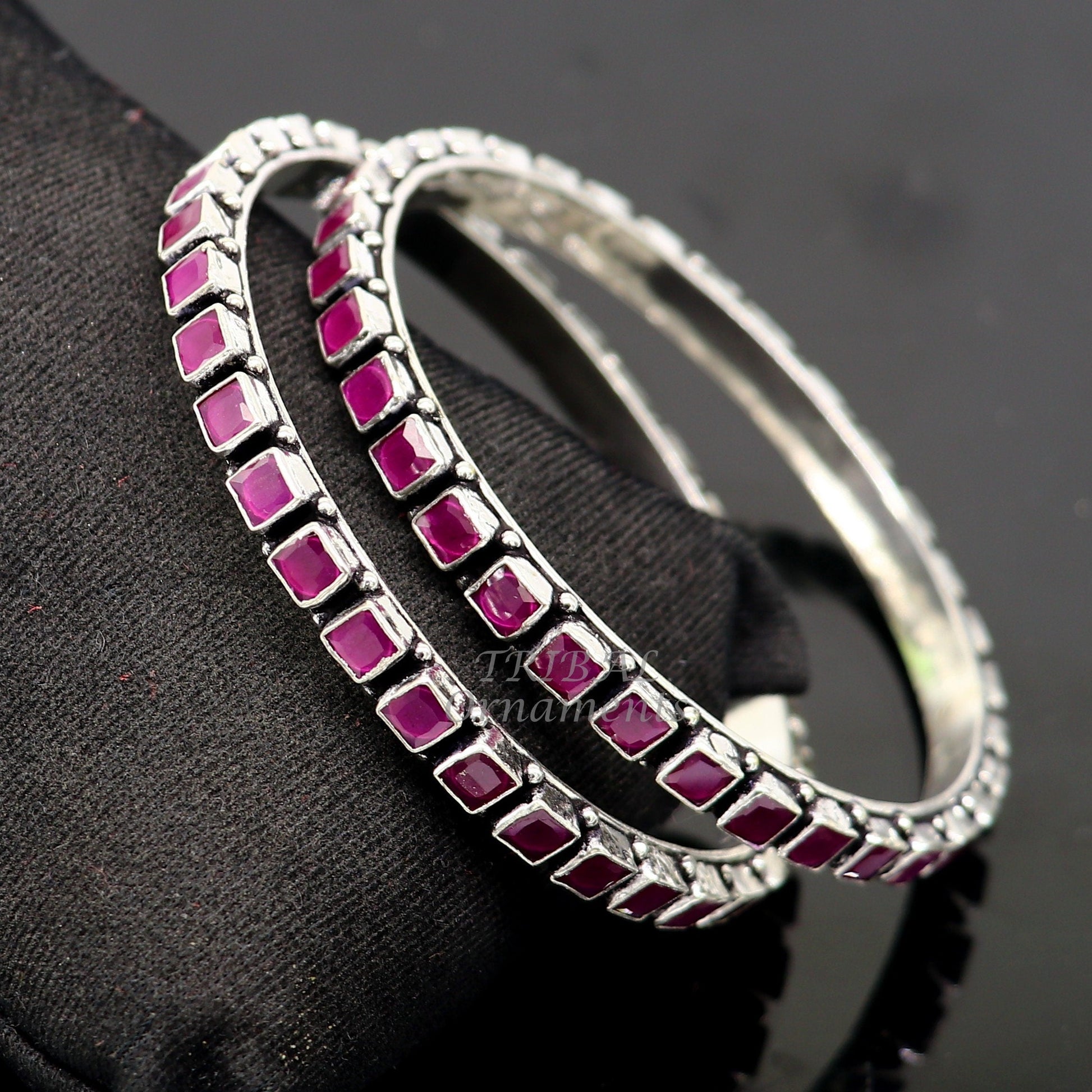 Sterling silver red cut stone bangle bracelet by TRIBAL ORNAMENTS, featuring a stylish design for girls and women.
