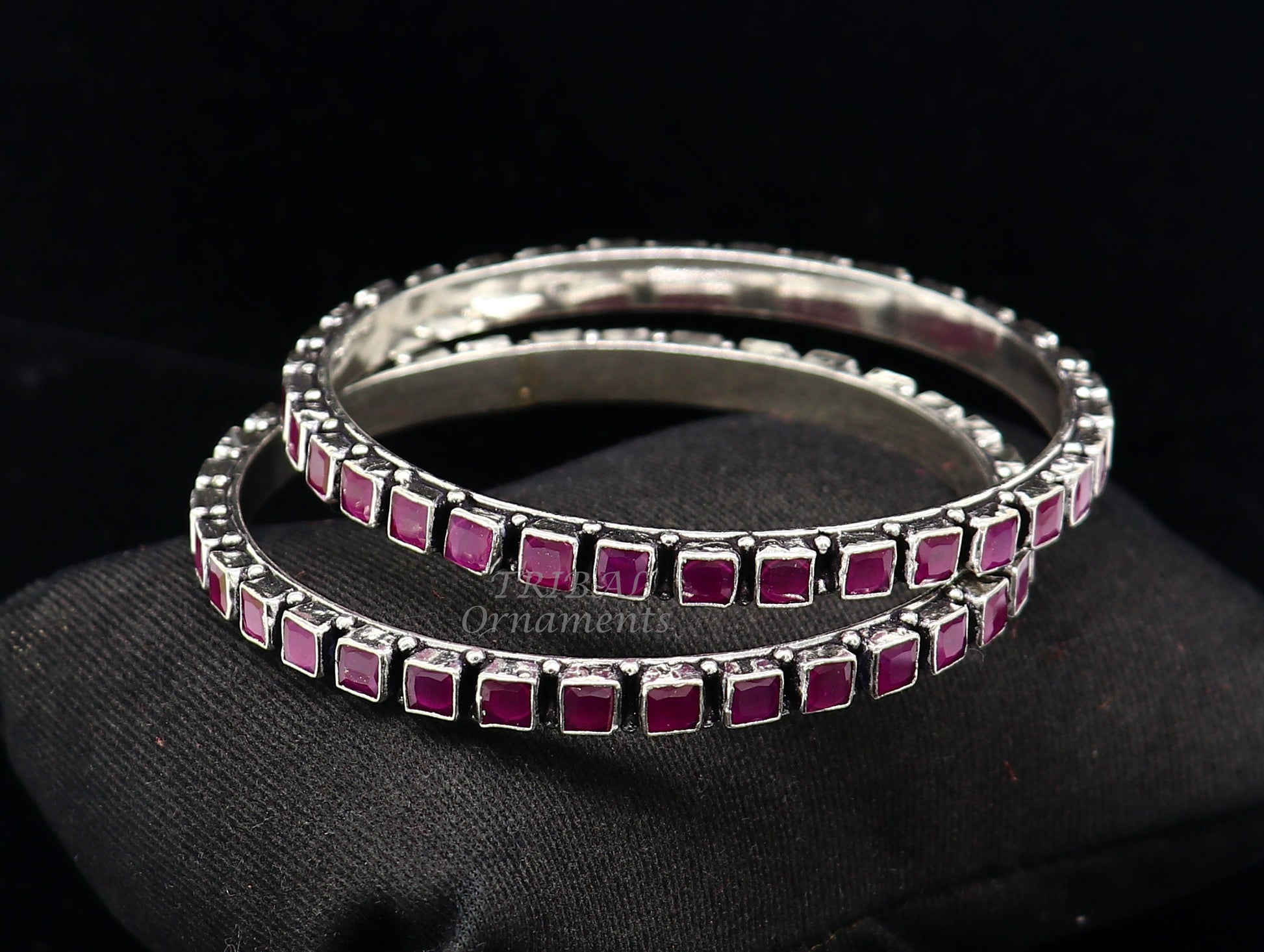 Sterling silver bangle bracelet with a vibrant red cut stone, stylish jewelry for women and girls, by TRIBAL ORNAMENTS.