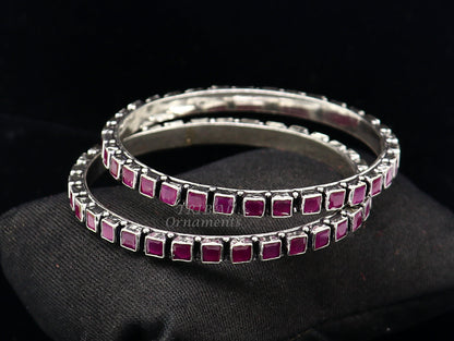 Sterling silver bangle bracelet with a vibrant red cut stone, stylish jewelry for women and girls, by TRIBAL ORNAMENTS.