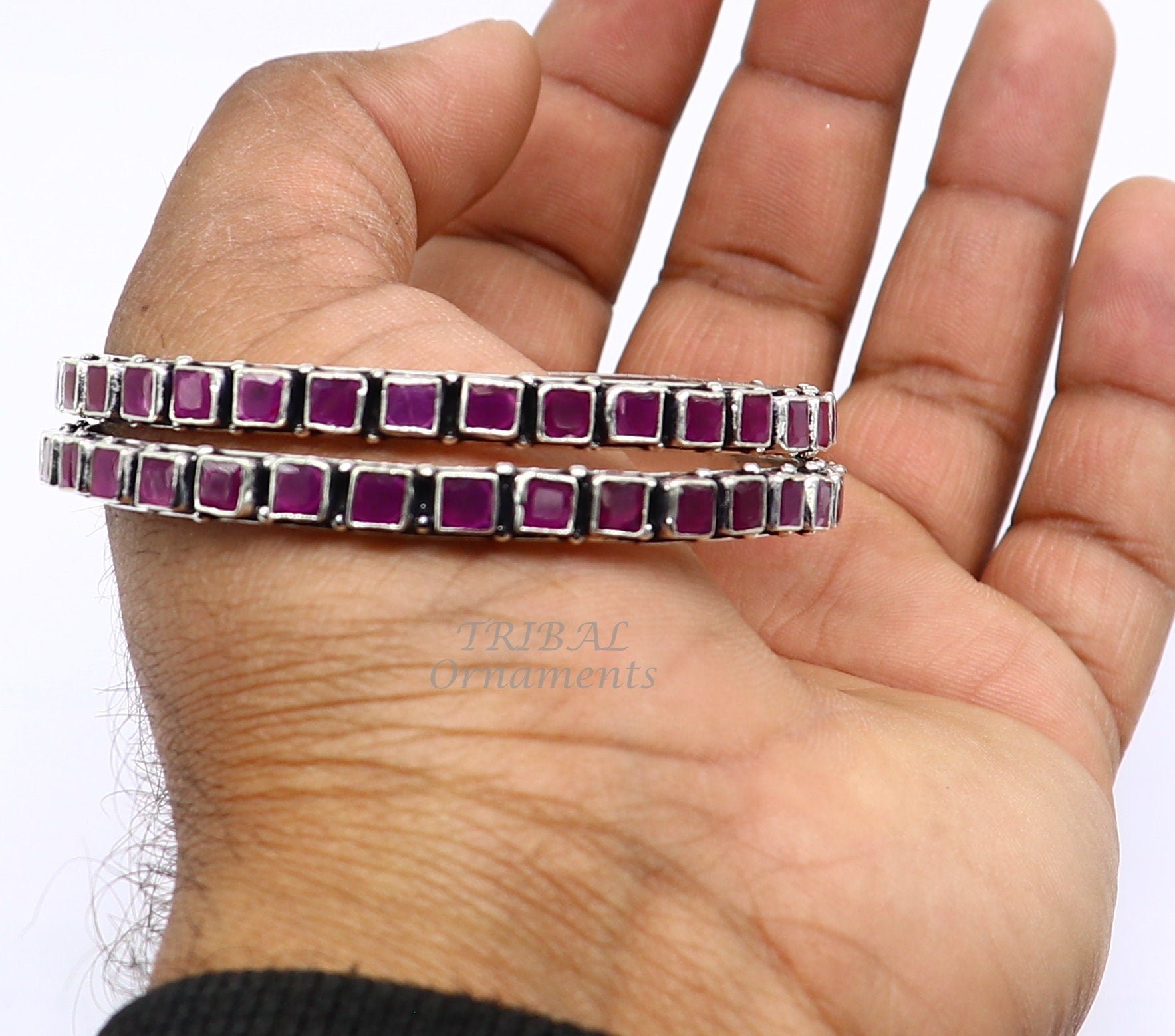 Sterling silver bangle bracelet with vibrant red cut stone from TRIBAL ORNAMENTS, stylish jewelry for girls and women.