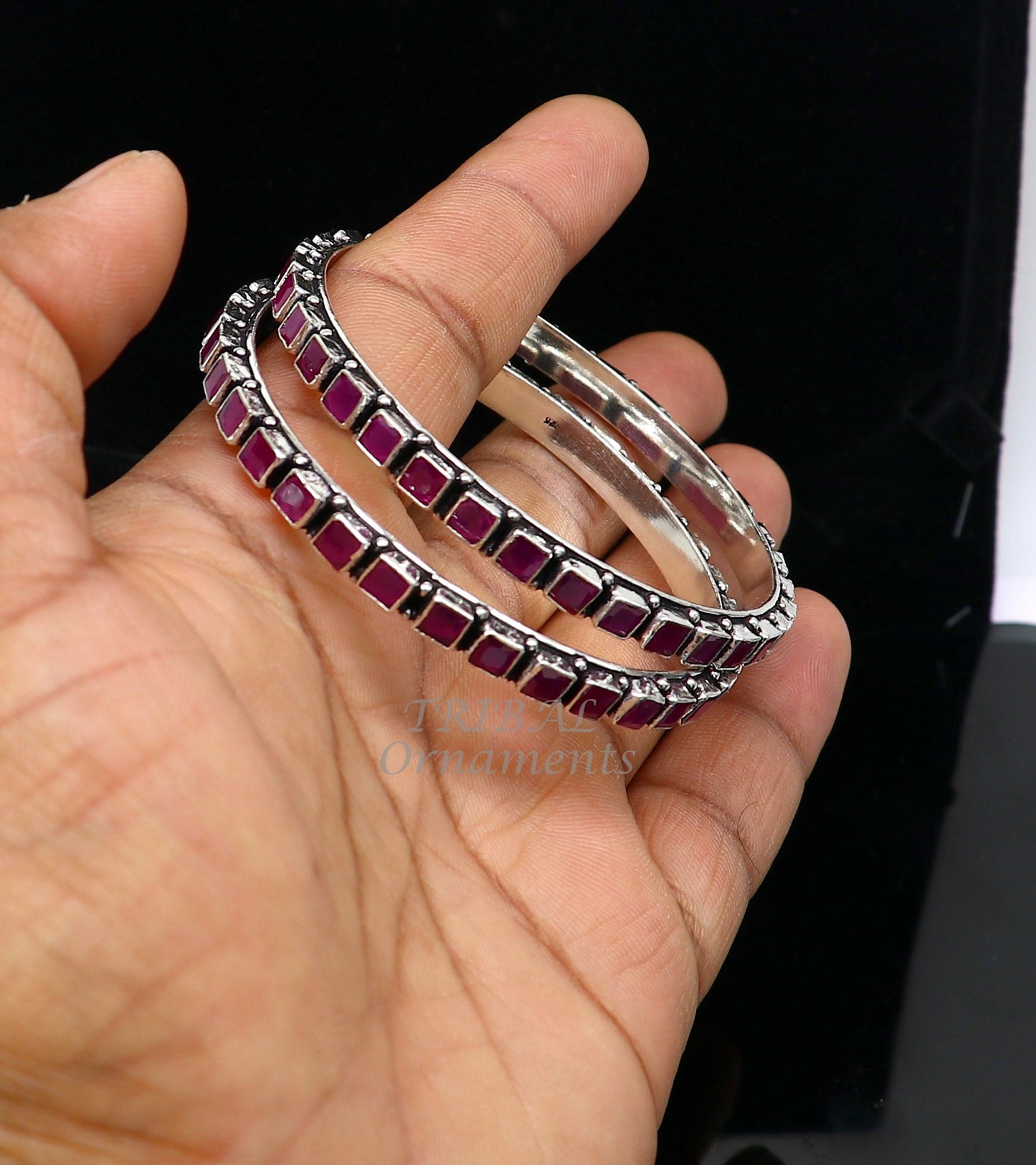 Sterling silver bangle bracelet with a vibrant red cut stone, stylish jewelry for girls and women by TRIBAL ORNAMENTS.