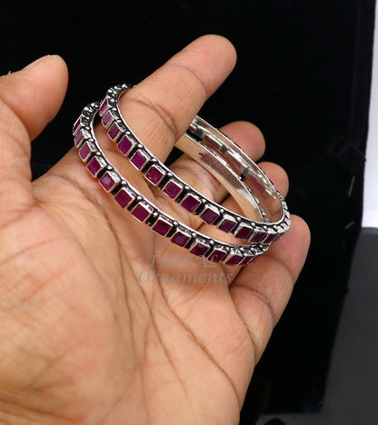 Sterling silver bangle bracelet with a vibrant red cut stone, stylish jewelry for girls and women by TRIBAL ORNAMENTS.