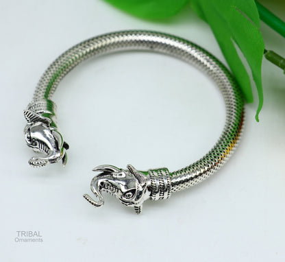 Sterling silver elephant face bangle bracelet by Tribal Ornaments, unisex tribal jewelry with detailed elephant design.