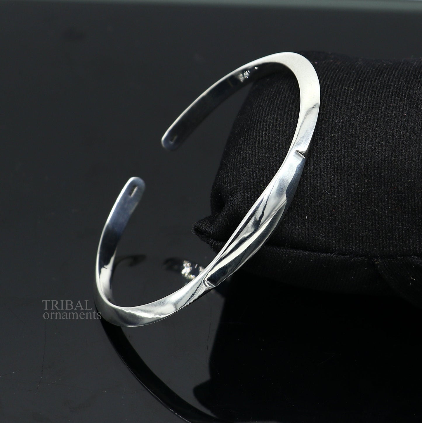 Sterling silver plain shiny bangle cuff bracelet by Tribal Ornaments, adjustable designer jewelry for men and women.