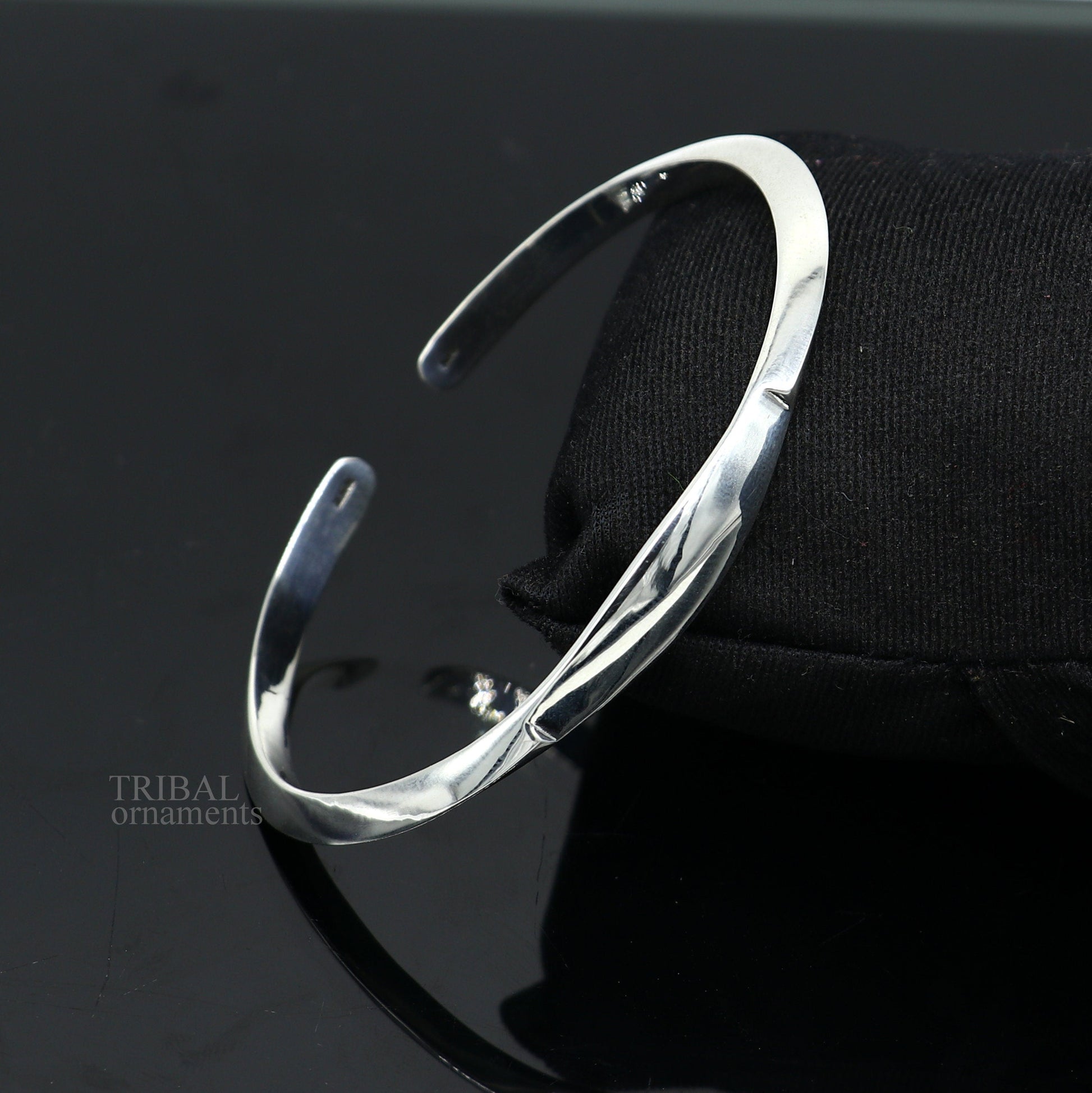 Sterling silver plain shiny bangle cuff bracelet by Tribal Ornaments, adjustable designer jewelry for men and women.