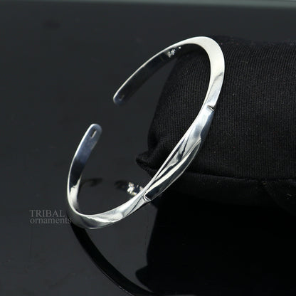 Sterling silver plain shiny bangle cuff bracelet by Tribal Ornaments, adjustable designer jewelry for men and women.