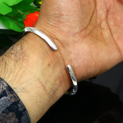 Sterling silver shiny bangle cuff bracelet by TRIBAL ORNAMENTS, adjustable, plain design suitable for men or girls.
