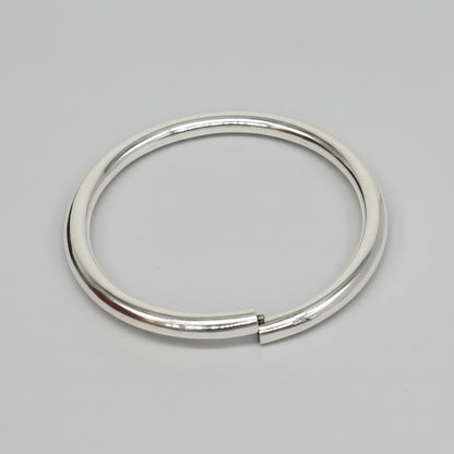 Sterling silver shiny bangle bracelet by Tribal Ornaments, stylish handmade kada for men or women, elegant and bright jewelry piece.