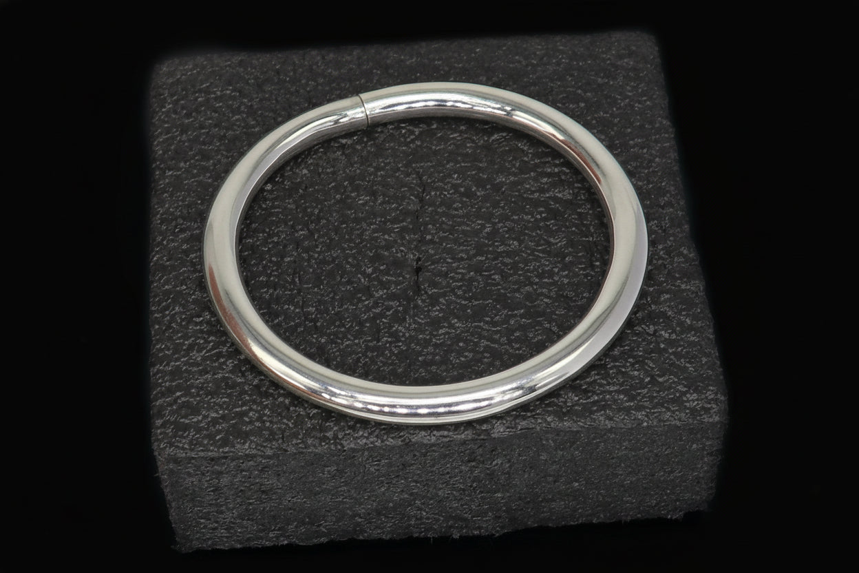 Sterling silver bangle bracelet with shiny, smooth finish, stylish handmade design, suitable for men or girls.