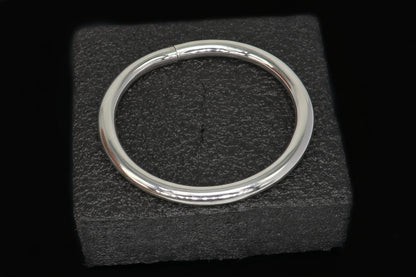 Sterling silver bangle bracelet with shiny, smooth finish, stylish handmade design, suitable for men or girls.