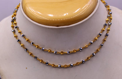 22KT yellow gold handmade mala chain with black stone beads, diamond cut beads, 24-inch unisex necklace, hallmarked by TRIBAL ORNAMENTS.