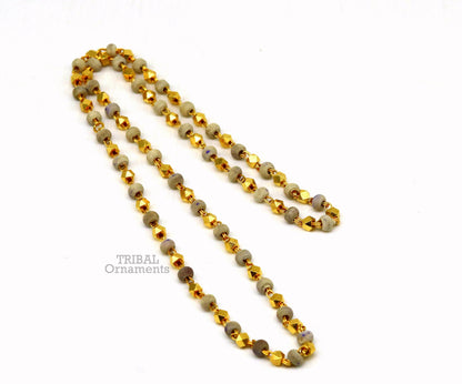 Sterling silver handmade wooden basil rosary beads with silver chain over gold-polished necklace, featuring a customized tulsi mala design.