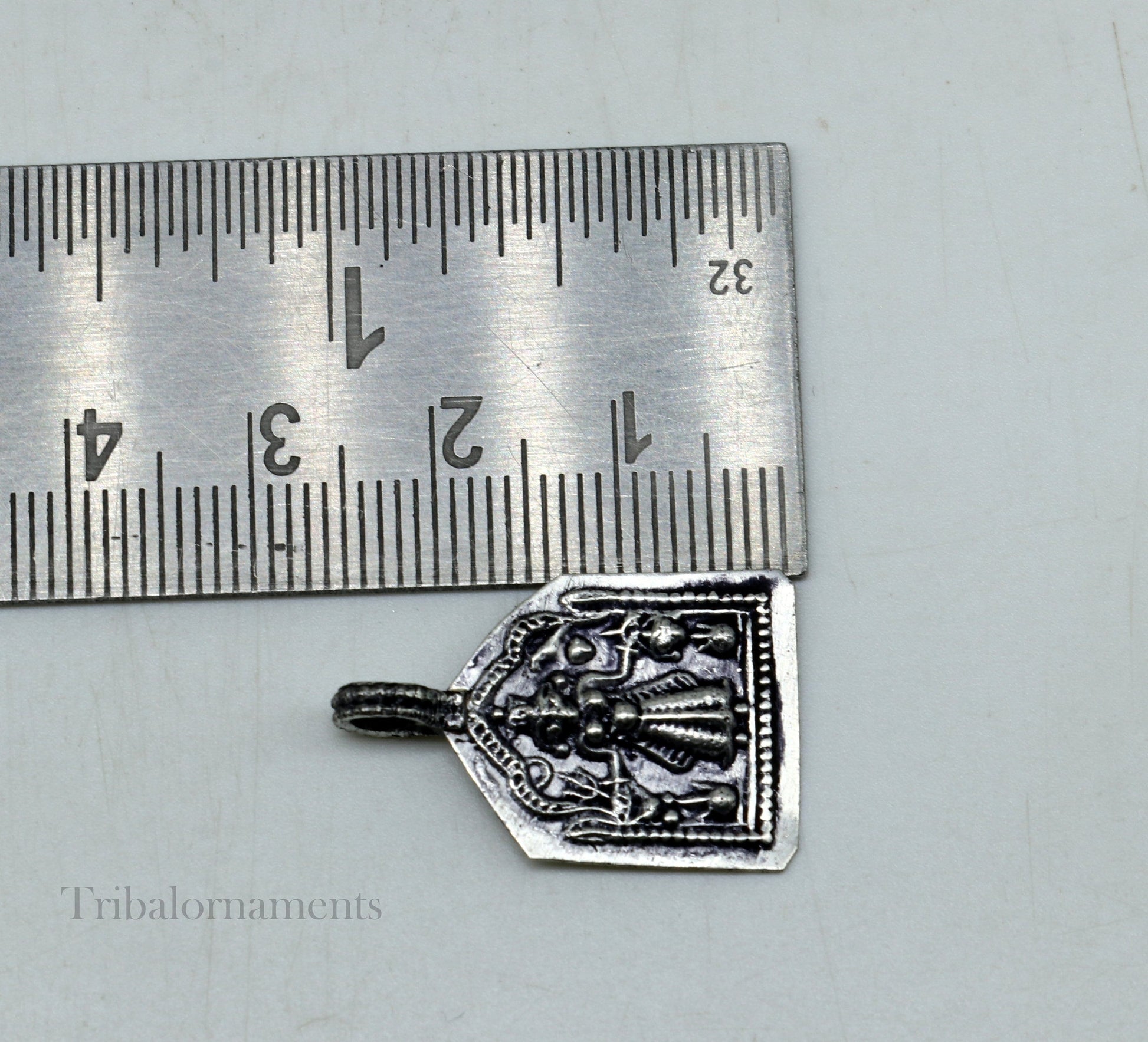 Vintage 925 sterling silver Hindu deity Mataji pendant from Tribal Ornaments, featuring intricate tribal-style craftsmanship.