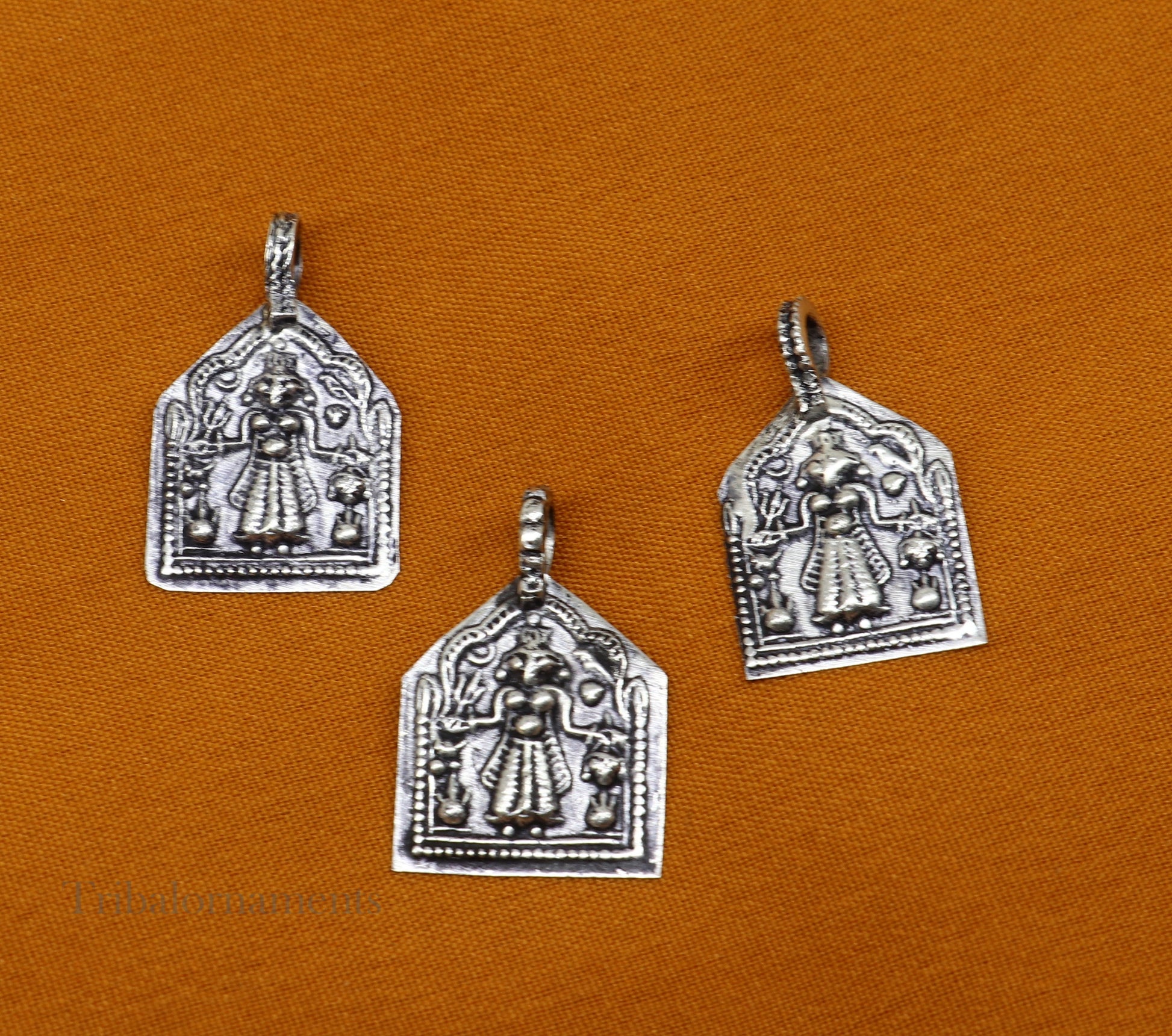 Sterling silver vintage Hindu deity Mataji pendant from Tribal Ornaments, handcrafted tribal jewelry with intricate design.