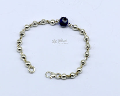 Silver evil eye bracelet or anklet with beaded design for girls and kids, featuring a sterling silver Nazariya charm.