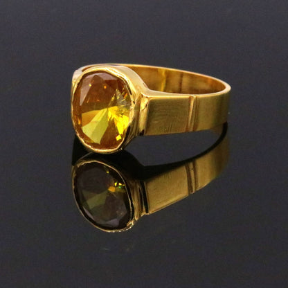 22k yellow gold handmade ring with a vibrant yellow citrine sunela stone, featuring traditional jadau jewelry design from Rajasthan.
