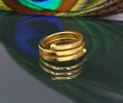22KT yellow gold handmade spiral ring by TRIBAL ORNAMENTS, vintage antique design, unisex band with intricate craftsmanship.