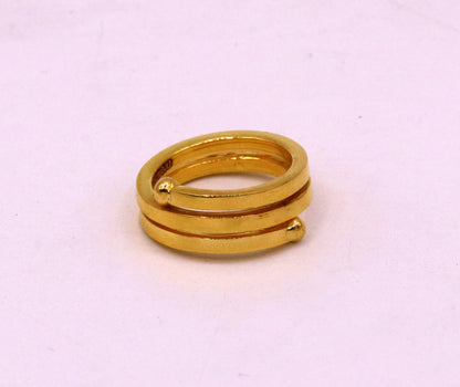 22KT yellow gold handmade spiral ring with vintage antique design, unisex band, showcasing intricate craftsmanship and tribal style.