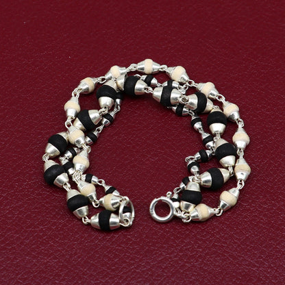 Black and white tulsi plant wood beaded sterling silver handmade 3-line bracelet by Tribal Ornaments.