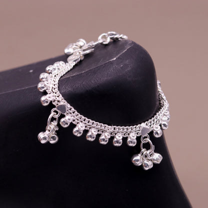 Vintage sterling silver baby anklet with hanging bells and drop charms, handmade tribal jewelry from India.