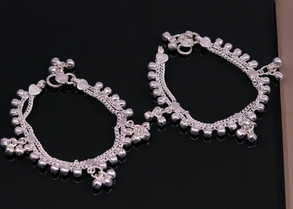 Sterling silver vintage baby anklet with hanging bells and charms, handmade tribal design from India.