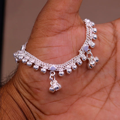 Vintage sterling silver baby anklet with hanging bell charms, handmade tribal design from India, perfect for delicate ankle jewelry.