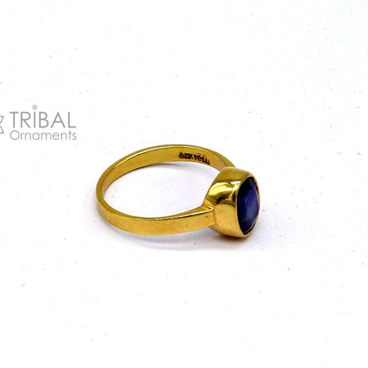 22KT yellow gold handmade blue sapphire ring with unisex design and zodiac stone from Rajasthan, India, by TRIBAL ORNAMENTS.