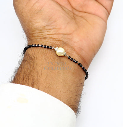 925 sterling silver Nazariya bracelet with black beads, customized jewelry for girls, featuring protective evil eye design by Tribal Ornaments.