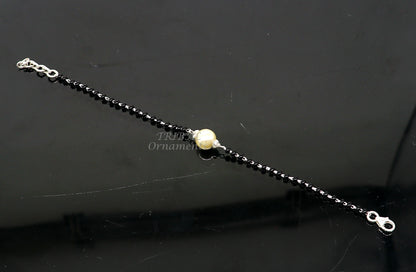 Sterling silver Nazariya bracelet with black beads, stylish jewelry from TRIBAL ORNAMENTS, designed to protect against evil eyes.