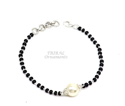 Sterling silver Nazariya bracelet with black beads, stylish jewelry for girls, featuring custom design to protect from evil eyes.