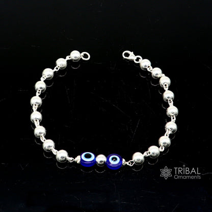Sterling silver handmade evil eye beaded bracelet by Tribal Ornaments, unisex, stylish, cultural jewelry in all sizes.