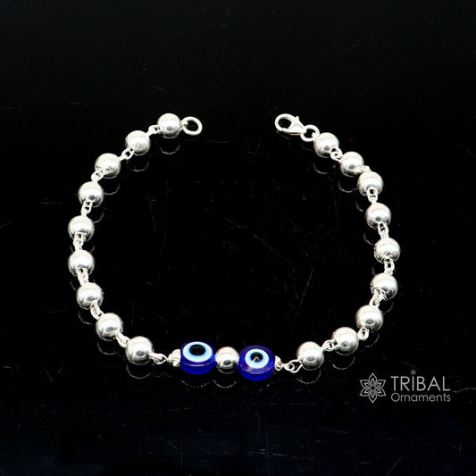 Sterling silver handmade evil eye beaded bracelet by Tribal Ornaments, unisex, stylish, cultural jewelry in all sizes.