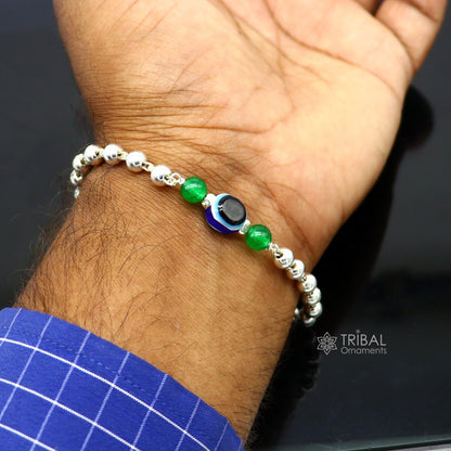 Unisex handmade 925 sterling silver evil eye beaded bracelet with intricate silver beads, stylish tribal design for trendy jewelry.