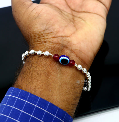Unisex 925 sterling silver handmade evil eye beaded bracelet by TRIBAL ORNAMENTS, featuring silver beads and cultural design.