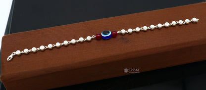 Sterling silver handmade beaded evil eye bracelet by Tribal Ornaments, unisex jewelry with cultural and trendy design.
