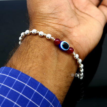 Unisex handmade 925 sterling silver evil eye beaded bracelet with intricate tribal design, stylish and culturally inspired jewelry.