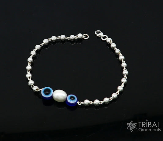 Unisex 925 sterling silver handmade beaded evil eye bracelet with cultural, trendy design, crafted by TRIBAL ORNAMENTS.