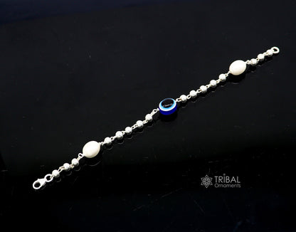 Handmade 925 sterling silver beaded evil eye bracelet by TRIBAL ORNAMENTS, unisex stylish jewelry with cultural design.